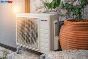 Air conditioning unit on a city building, working to maintain AC performance and prevent AC problems caused by high temperatures in summer.
